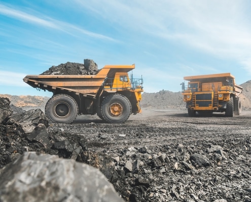 Large quarry dump truck. Loading the rock in dumper. Loading coal into body truck. Production useful minerals. Mining truck mining machinery, to transport coal from open-pit as the Coal Production